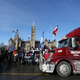 Supporters of the Freedom Convoy protest against Covid-19 vaccine mandates and restrictions in front of Parliament of Canada in January 28, 2022 in Ottawa, Canada. - A convoy of truckers started off from Vancouver on January 23, 2022 on its way to protest against the mandate in the capital city of Ottawa.
